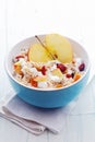 Bowl of healthy breakfast cereal and apple Royalty Free Stock Photo
