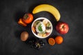 Bowl of healthy fresh fruit salad on black chalkboard Royalty Free Stock Photo
