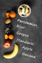 Bowl of healthy fresh fruit salad on black chalkboard Royalty Free Stock Photo