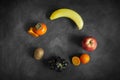 Bowl of healthy fresh fruit salad on black chalkboard Royalty Free Stock Photo