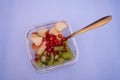 Bowl of healthy fresh fruit salad with fork and knife Royalty Free Stock Photo