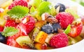 Bowl of healthy fresh fruit salad with honey. Royalty Free Stock Photo