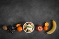 Bowl of healthy fresh fruit salad with mint on black chalkboard Royalty Free Stock Photo