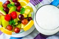 Bowl of healthy fresh fruit salad on pattern of Thai hand made fabric background Royalty Free Stock Photo