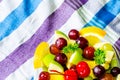 Bowl of healthy fresh fruit salad on pattern of Thai hand made fabric background Royalty Free Stock Photo