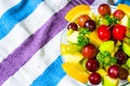 Bowl of healthy fresh fruit salad on pattern of Thai hand made fabric background Royalty Free Stock Photo