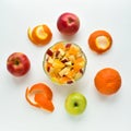 Bowl of healthy fresh fruit salad on wooden background. Top view. Citrus fruits on a white background Royalty Free Stock Photo