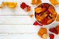 Bowl of healthy vegetable chips, top view with copy space on white wood