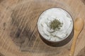 Bowl of healthy yogurth with a wooden spoon, indoor photography, close up