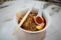 A bowl of Hokkien mee, which is a Chinese noodle dish popular in Penang, Malaysia. This version is made from spicy prawn broth Royalty Free Stock Photo
