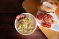 Corn chowder soup with bacon. Brown wooden background. Close-up view Royalty Free Stock Photo