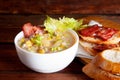 Corn chowder soup with bacon. Brown wooden background. Close-up view Royalty Free Stock Photo