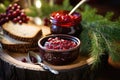 bowl of homemade cranberry jam near bread