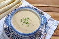 Bowl of homemade cream soup from white asparagus, spring season, new harvest of Dutch, German white asparagus, cooking with Royalty Free Stock Photo