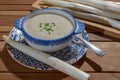 Bowl of homemade cream soup from white asparagus, spring season, new harvest of Dutch, German white asparagus, cooking with Royalty Free Stock Photo