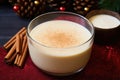 a bowl of homemade eggnog topped with a sprinkle of nutmeg