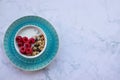 Bowl of homemade granola cereal with greek yogurt and fresh raspberry berries on white marble table background. Top view Royalty Free Stock Photo