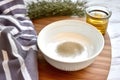 bowl of homemade hair mask mixture on a kitchen top