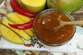 Bowl of homemade Mango Chutney on old wooden table Royalty Free Stock Photo