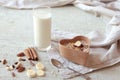 Bowl of homemade muesli with nuts, berries, dried fruits, glass of milk and honey. healthy breakfast Royalty Free Stock Photo