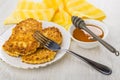 Bowl with honey, stick, cottage cheese pancakes in white plate Royalty Free Stock Photo