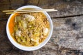 In the bowl of hot instant noodles with vegetables, egg, tofu, pork chops and serve. Royalty Free Stock Photo