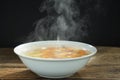 Steaming of hot soup in white bowl. Royalty Free Stock Photo