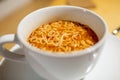 A bowl of hot spicy noodle soup closeup with out of focus elements Royalty Free Stock Photo