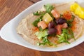 Bowl of hummus topped with salad Royalty Free Stock Photo