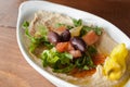 Bowl of hummus topped with salad Royalty Free Stock Photo