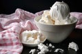 a bowl of ice cream next to a pile of crumpled tissues