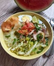 A bowl of Indonesian food called soto ayam