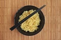 A Bowl of instant noodles on wooden background