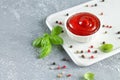 Bowl dip of ketchup or red tomato sauce on kitchen table Royalty Free Stock Photo