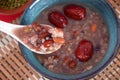 A bowl of Laba porridge, mung beans and red beans for Laba Festival