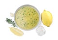 Bowl with lemon sauce and ingredients on white background, top view. Delicious salad dressing Royalty Free Stock Photo