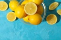 Bowl with lemons on background, top view. Ripe fruit Royalty Free Stock Photo