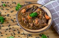 A Bowl of lentil stew on wooden table Royalty Free Stock Photo