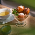 Bowl of Lokma Turkish, loukoumades Greeek with other names in other languages, pastries deep fried dough, soaked in