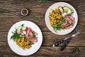 Bowl lunch with grilled beef steak and quinoa, corn, cucumber, radish and arugula Royalty Free Stock Photo