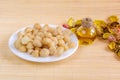 Bowl of macadamia nut and oil Royalty Free Stock Photo