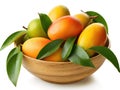 Bowl with mangoes and green leaves