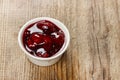 Bowl of marmalade on wooden table Royalty Free Stock Photo