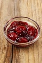 Bowl of marmalade on wooden table Royalty Free Stock Photo