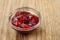 Bowl of marmalade on wooden table Royalty Free Stock Photo