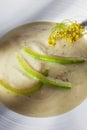 A bowl of marrow cream with dill
