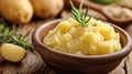 A bowl of mashed potatoes with a sprig of rosemary, AI Royalty Free Stock Photo