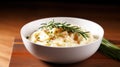 a bowl of mashed potatoes with a sprig of rosemary Royalty Free Stock Photo