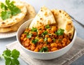 A bowl of Mauritian farata (flatbread) served with bean curry garnished with fresh coriander Royalty Free Stock Photo