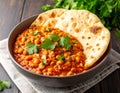 A bowl of Mauritian farata (flatbread) served with bean curry garnished with fresh coriander Royalty Free Stock Photo